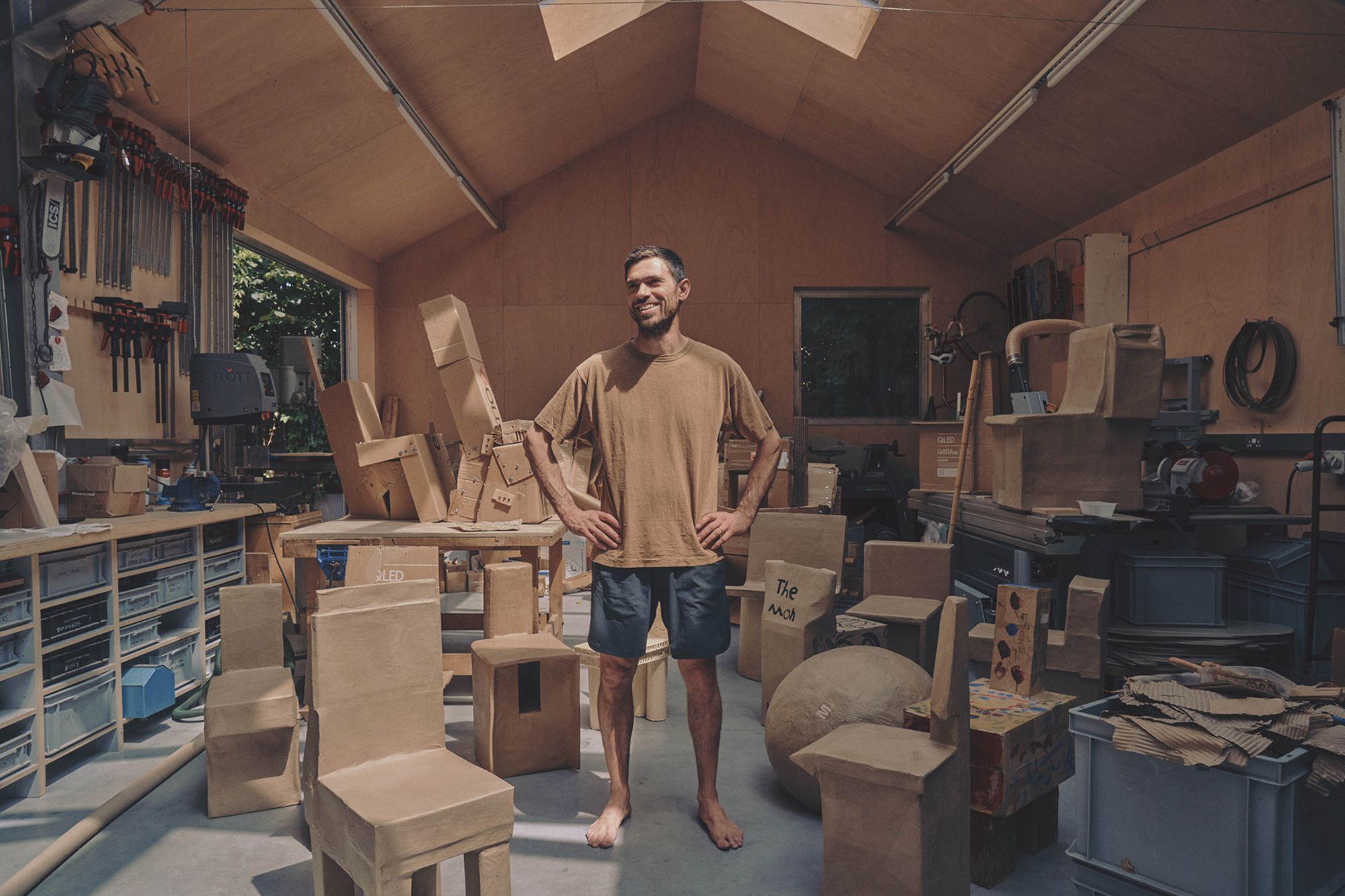 Designer Max Lamb with some of his cardboard furniture.