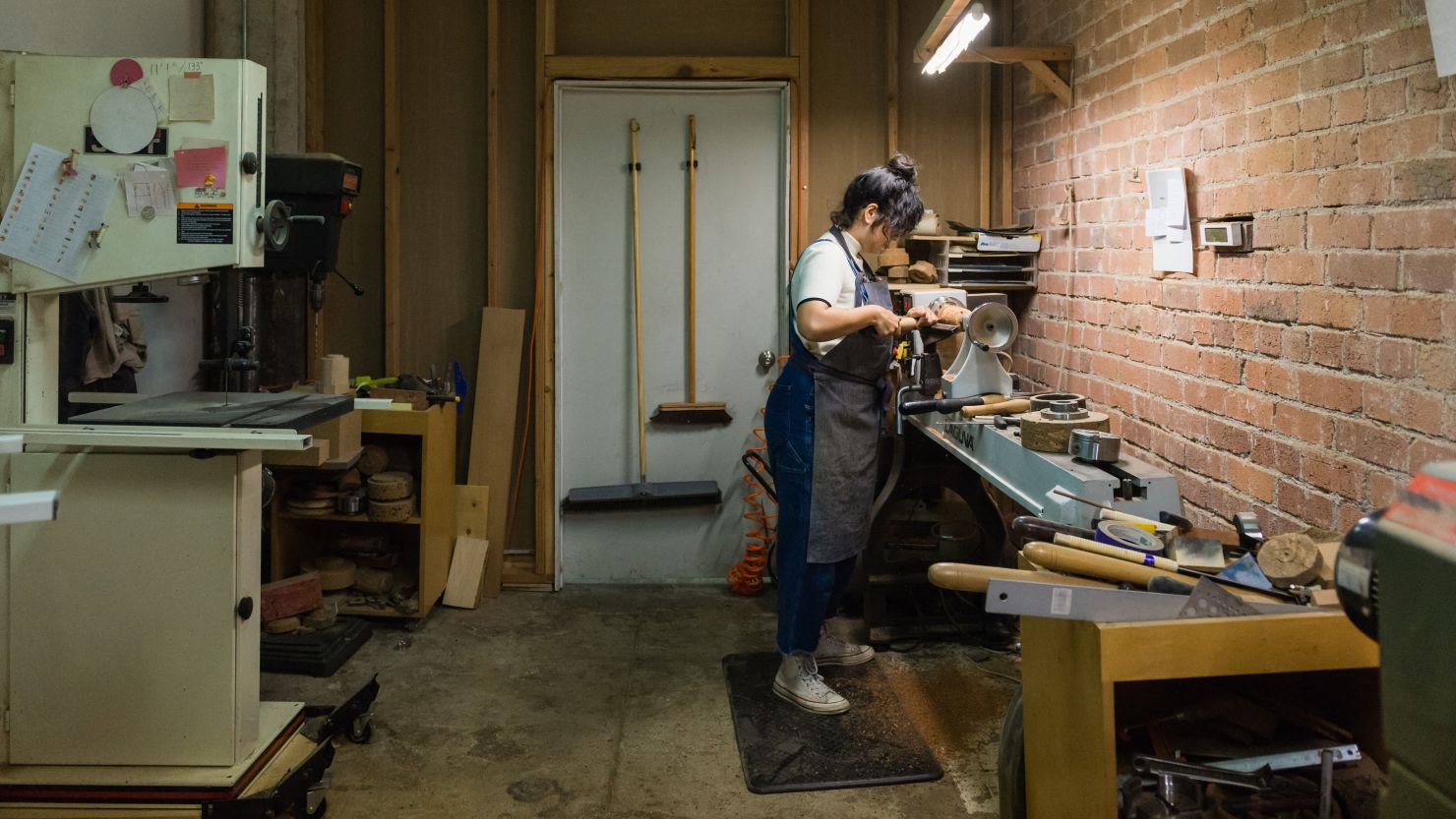 Melanie Abrantes turns a cork vase for her sustainable home goods collection made with Portuguese cork in her Oakland, California, studio in 2020,