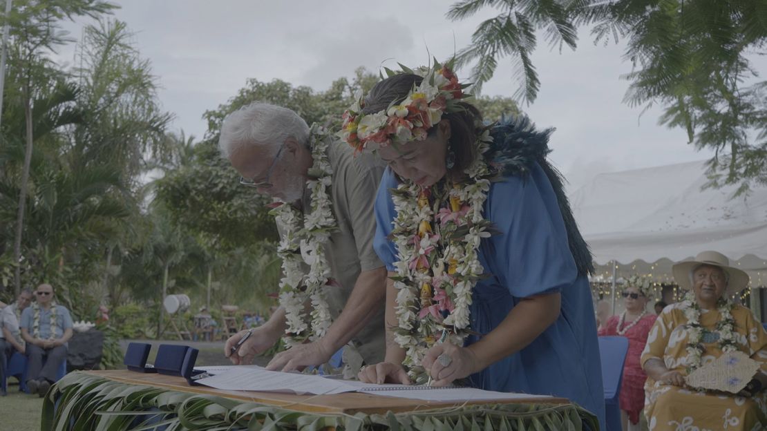 Mere Takoko (right) signs the He Whakaputanga Moana declaration in Rarotonga, Cook Islands.