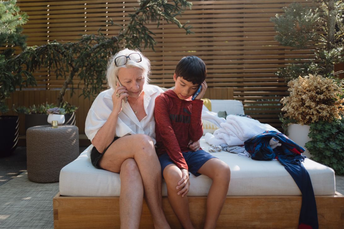 Mimi Lettunich consults with the family’s attorney while David Merlos talks to his detained mother on the phone.