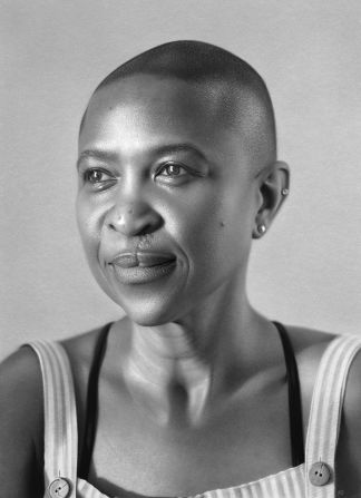Okafor spent 900 hours on this portrait of healthcare support worker Michéllé Brown.<strong> </strong>Drawing his subjects often makes him more curious about their experiences. “When I learned from Michéllé Brown that the scarring on her nose was caused by a surgical anchor for her cleft palate, it deepened my understanding and gave me more sensitivity to portray her with care,” he said.