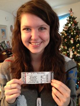 Mikaela Dee poses in 2013 after receiving her very first One Direction concert tickets for the Where We Are Tour.