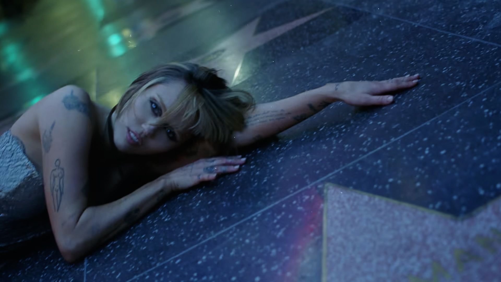 Miley Cyrus reveals she got down and dirty on the Hollywood Walk of Fame while filming secret music video for her new album Something Beautiful