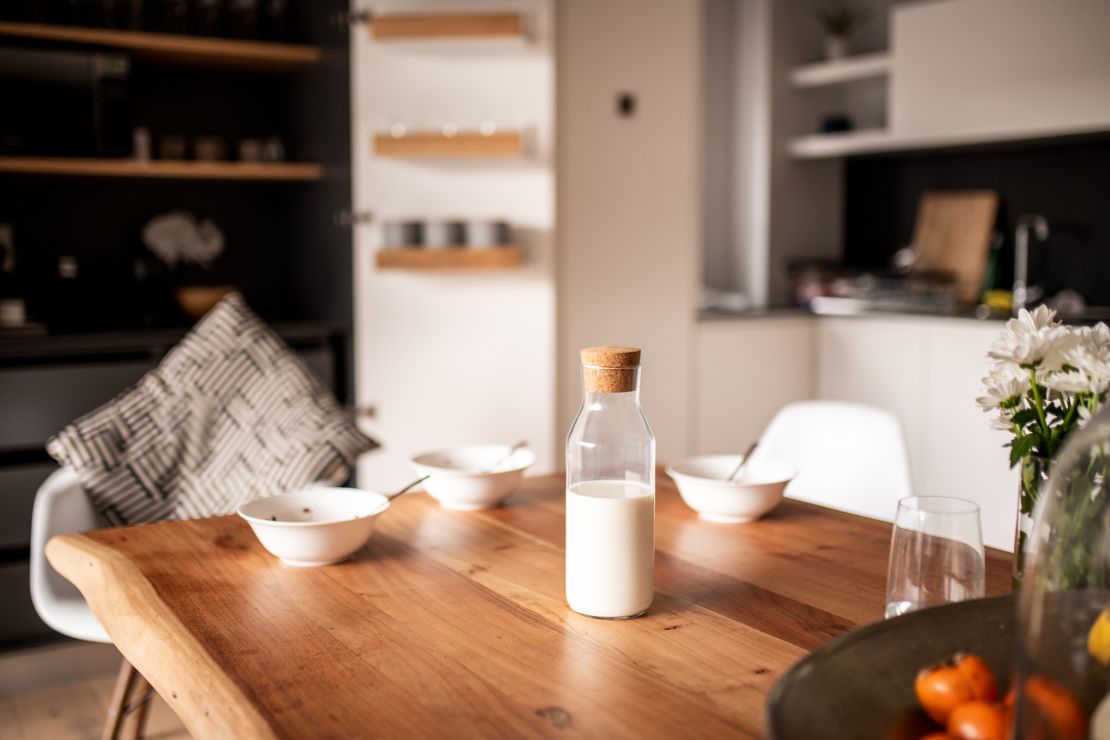 milk-in-bottle-at-kitchen-table-set-for-breakfast.jpg