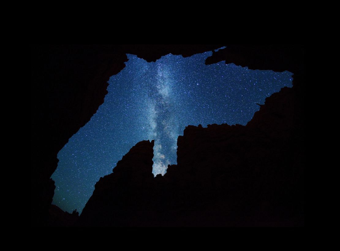 The Milky Way over a silhouette of the narrow "Wall Street" canyon in Bryce Canyon National Park, a Dark Sky reserve.