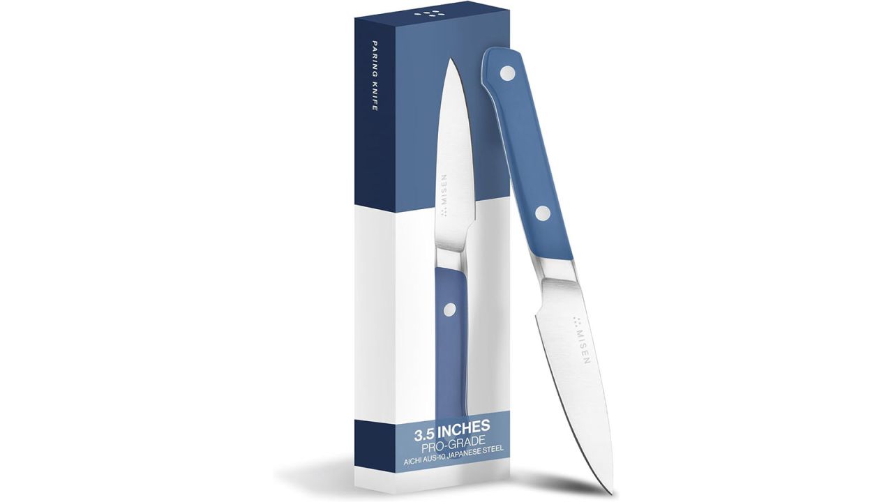 Misen Precision Knife leaning against product box, both surrounded by white background.