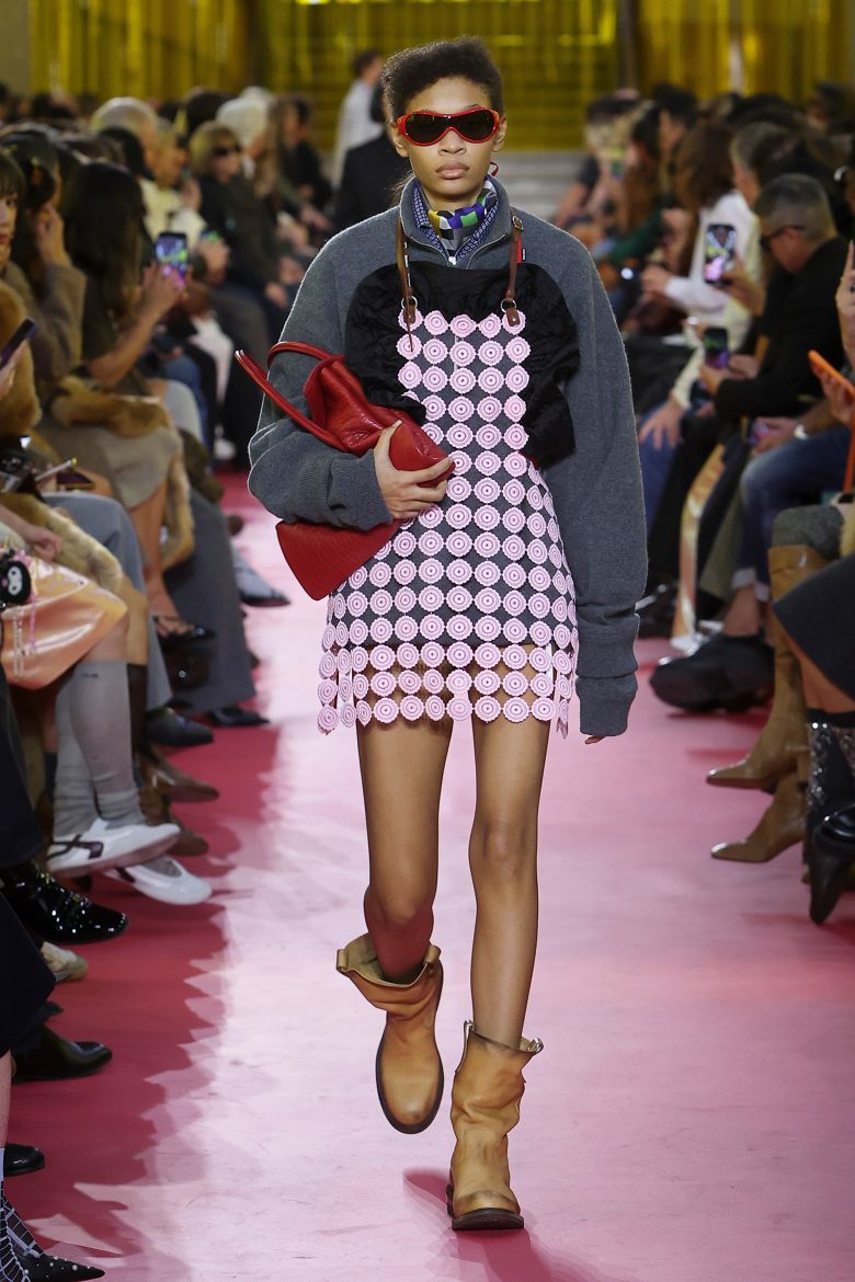 The classic symbol of work was styled over bikinis and outerwear.