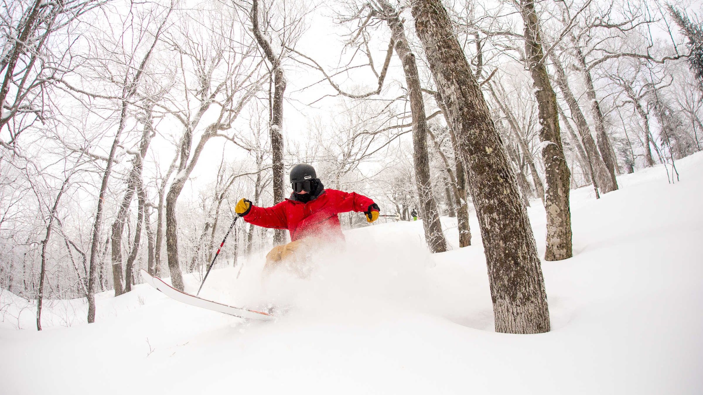 A photo of a person skiing in the Okemo Mountain Resort