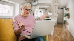 older woman checking how much life insurance she needs