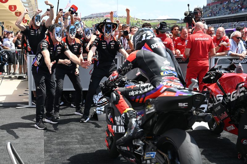 Maverick Viñales' team greets him at the finish wearing Caped Crusader masks.