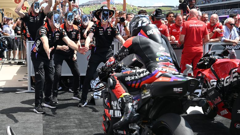 MotoGP-Vinales is greeted by his Aprilia team in Batman masks.JPG