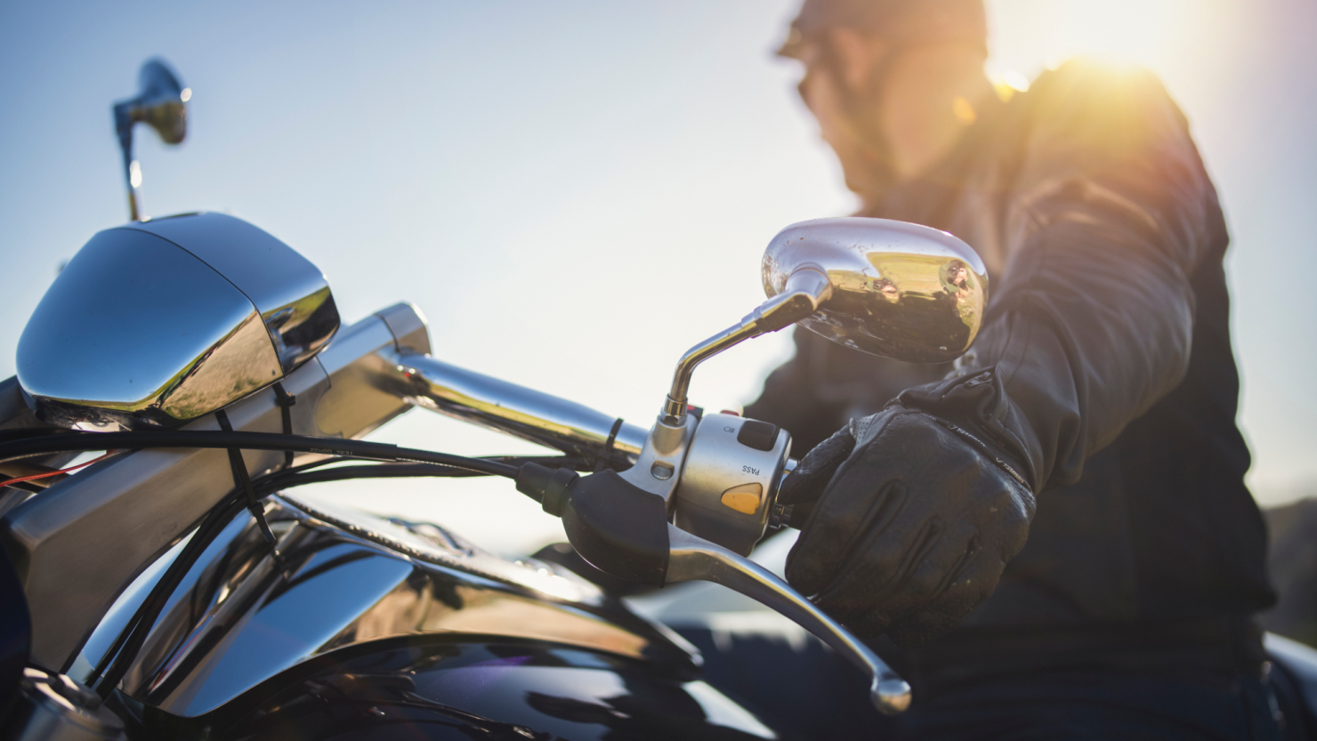 Close-up shot of motorcyclist at sunset