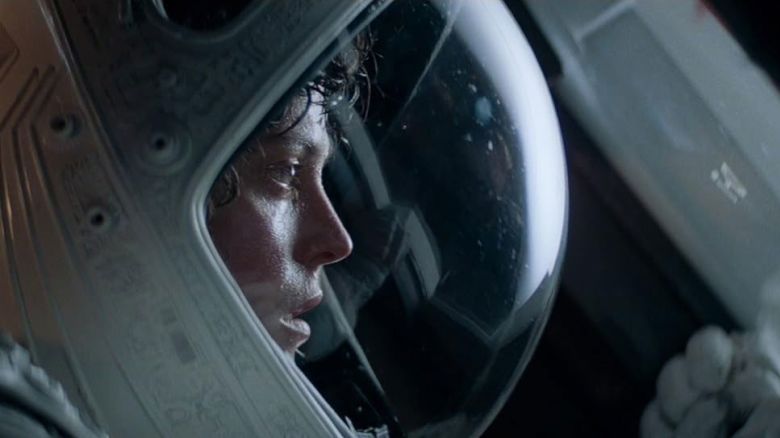 A still from the movie Alien, showing Sigourney Weaver in a space helmet. 