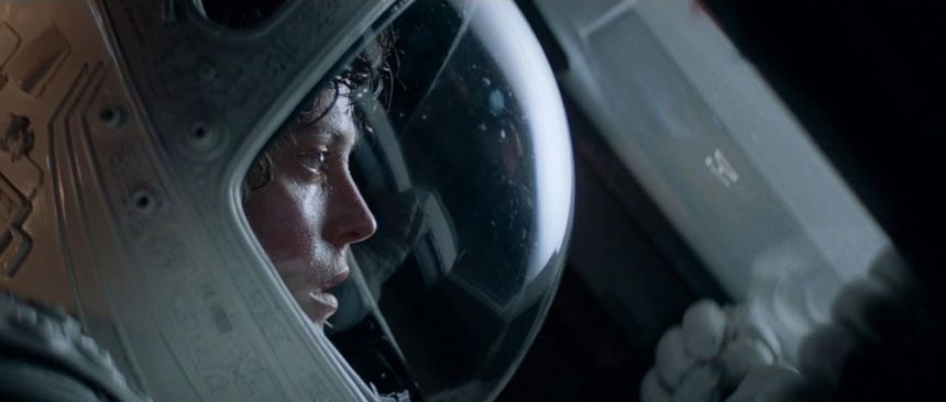 A still from the movie Alien, showing Sigourney Weaver in a space helmet. 