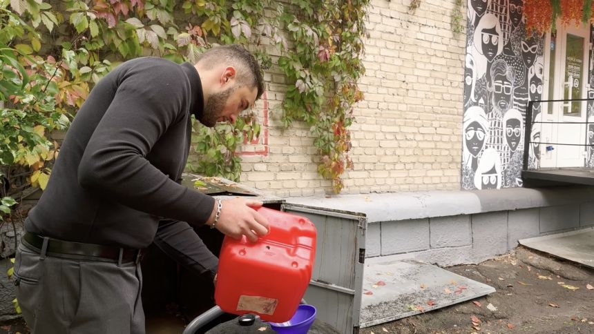 Coffee shop owner Mykyta Varenya, 26, fills his generator during a blackout in Kyiv on Friday.