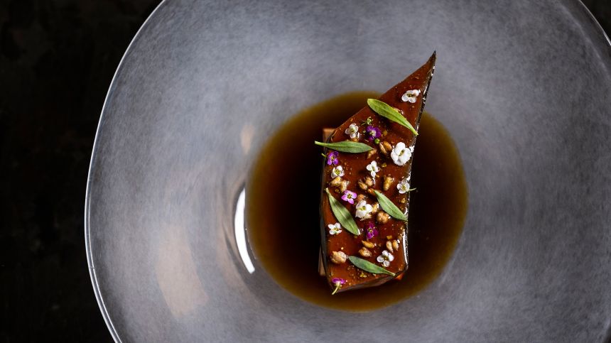 Atomix serves up dishes such as this blackened banana with monkfish liver.