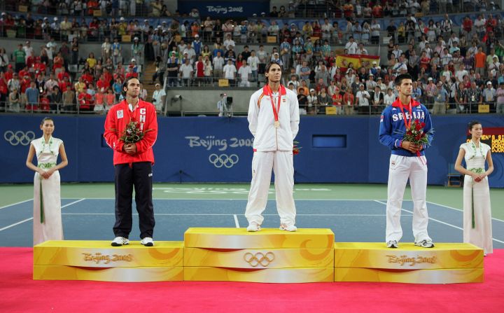 Nadal, center, listens to the Spanish national anthem after winning gold at the Beijing Olympics in August 2008. He defeated Chile’s Fernando Gonzalez in the final. Serbia’s Novak Djokovic, seen on the right, won the bronze.