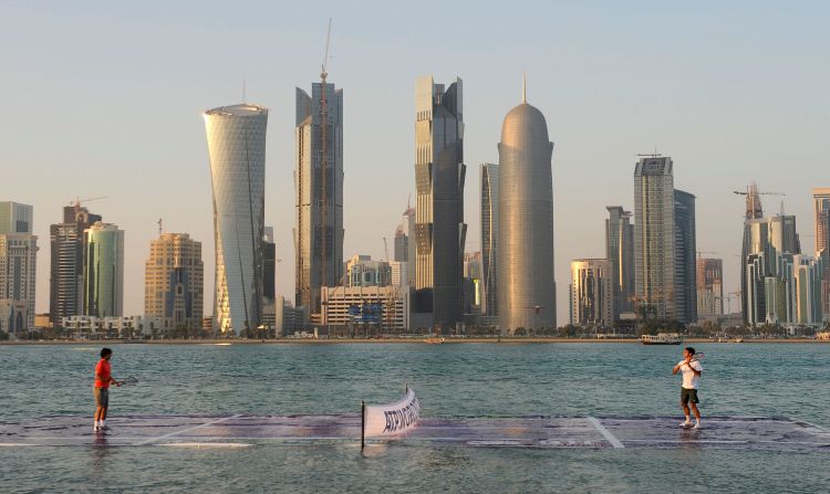 Nadal and Federer play on a floating court to promote the city of Doha, Qatar, ahead of the Qatar Open in 2011.