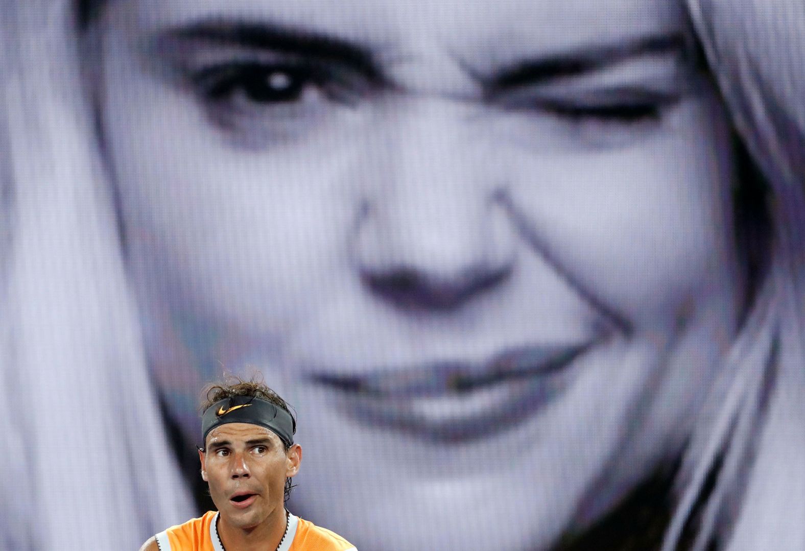 An advertisement is seen behind Nadal during an Australian Open match in January 2019.