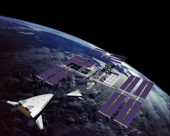 The X-33 was meant to pave the way for a full-scale reusable spacecraft to be used in missions involving the International Space Station, as this artist's impression suggests.