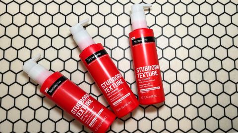 Three bottles of neutrogena stubborn texture acne cleanser