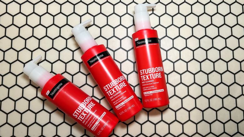 Three bottles of neutrogena stubborn texture acne cleanser