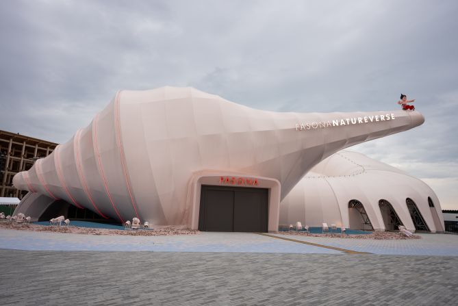 The <a href="https://www.expovisitors.expo2025.or.jp/pavilions/504dcba4-2976-42f1-9cb3-69f07e3c950f" target="_blank">Pasona Natureverse</a> explores life from its ancient origins to the future of regenerative medicine. The pavilion, designed by architect Satoshi Itasaka, takes inspiration from the <a href="https://www.pasonagroup.co.jp/english/news/tabid770.html?itemid=4583&dispmid=1331" target="_blank">ammonite</a>, a prehistoric <a href="https://www.nhm.ac.uk/discover/what-is-an-ammonite.html" target="_blank">shelled creature</a> most often seen as a spiral fossil. Outside<a href="https://en.awajishima-resort.com/world-expo-2025-guiding-the-future-with-astro-boy/" target="_blank">, Japanese anime character Astro Boy</a> poses on top of a conch-shaped structure.
