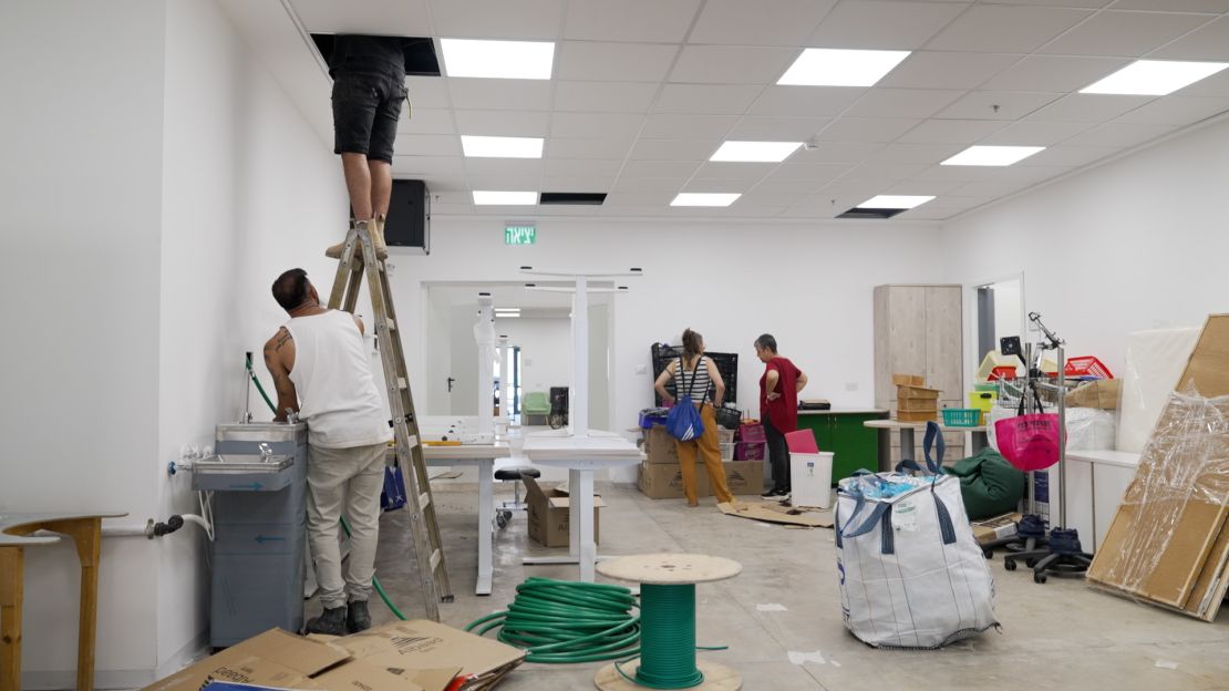 Teachers and workers at an old factory that is being converted into a new school for evacuated children in the town of Rosh Pina, Israel on August 22. 