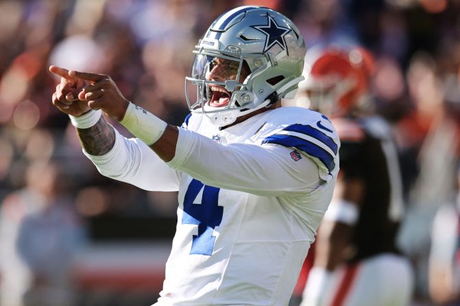 Dallas Cowboys quarterback Dak Prescott celebrates after a touchdown during the Cowboys' 33-17 victory over the Cleveland Browns in Cleveland on September 8. Hours before the game, <a >Prescott agreed to a record four-year, $240 million contract extension</a>, making him the highest-paid player in the NFL.