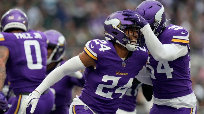 Minnesota Vikings safety Camryn Bynum (24) reacts after a play against the New York Jets during an NFL football game at Tottenham Hotspur Stadium, Sunday, Oct. 6, 2024 in London. (AP Photo/Steve Luciano)