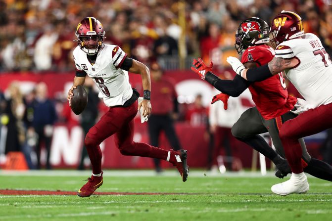 Washington Commanders quarterback Jayden Daniels carries the ball during the first half a wild-card playoff game against the Tampa Bay Buccaneers in Tampa, Florida, on January 12. The rookie quarterback lead his team to a 23-20 victory. The Commanders will take on the Detroit Lions next weekend.