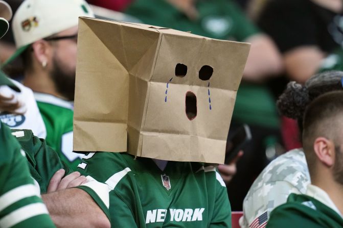 A New York Jets fan watches the second half of the Jets' 31-6 loss to the Arizona Cardinals in Glendale, Arizona, on November 10.