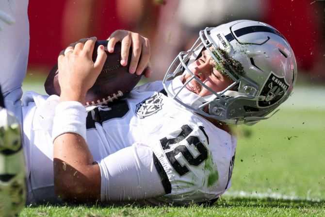 Las Vegas Raiders quarterback Aidan O'Connell is sacked by Tampa Bay Buccaneers linebacker Lavonte David in Tampa on December 8.