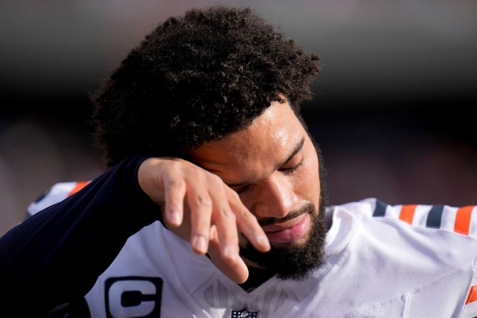 Chicago Bears quarterback Caleb Williams wipes sweat from his face on the sideline during his team's 30-27 loss to the Minnesota Vikings in Chicago on November 24.