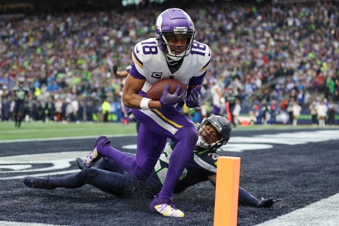 Minnesota Vikings wide receiver Justin Jefferson catches a touchdown pass against Seattle Seahawks cornerback Tre Brown during the Vikings' 27-24 win in Seattle on December 22.