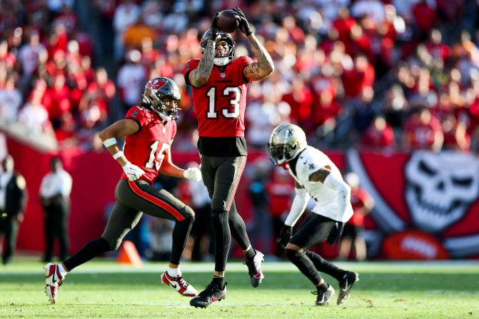 Tampa Bay Buccaneers wide receiver Mike Evans catches a pass in Tampa, Florida, on January 5. With the catch, <a href="index.php?page=&url=https%3A%2F%2Fwww.cnn.com%2F2025%2F01%2F05%2Fsport%2Ftampa-bay-buccaneers-mike-evans-spt%2Findex.html">Mike Evans extended his streak of 1,000-yards</a> in a season for the 11th in a row to tie Pro Football Hall of Famer Jerry Rice for the most ever consecutively. The Buccaneers beat the New Orleans Saints 27-19 and clinched playoff berth.