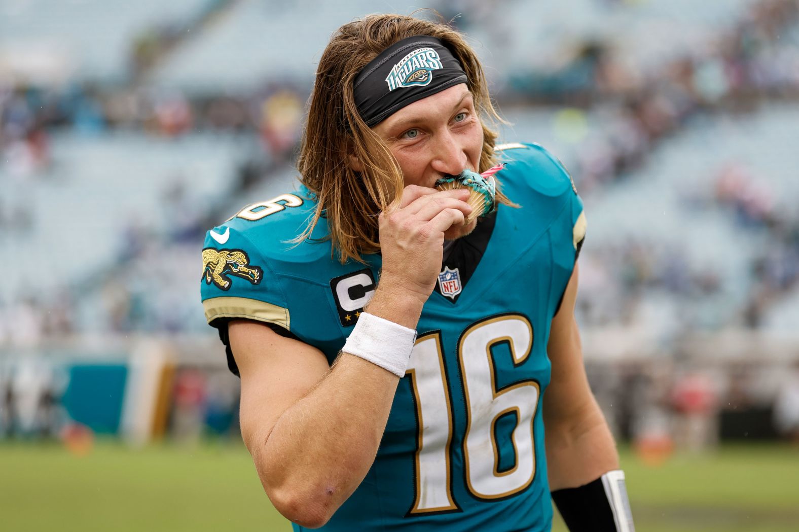 Jacksonville Jaguars quarterback Trevor Lawrence eats a cupcake to celebrate his birthday after his team beat the Indianapolis Colts 37-34 at home in Jacksonville, Florida, on October 6. It was the Jaguars' first win of the season.