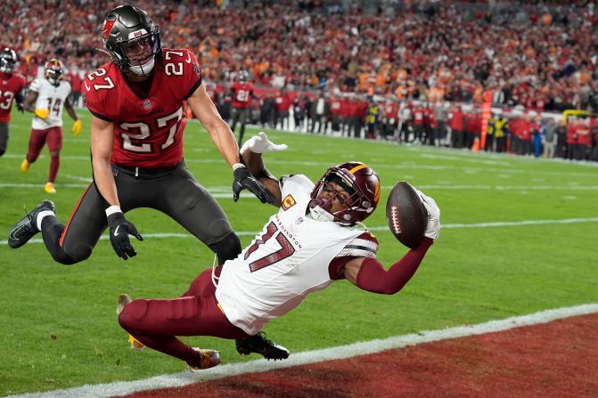 Washington Commanders wide receiver Terry McLaurin cannot catch a pass in the end zone while being defended by Tampa Bay Buccaneers cornerback Zyon McCollum in Tampa Bay, Florida, on January 12.