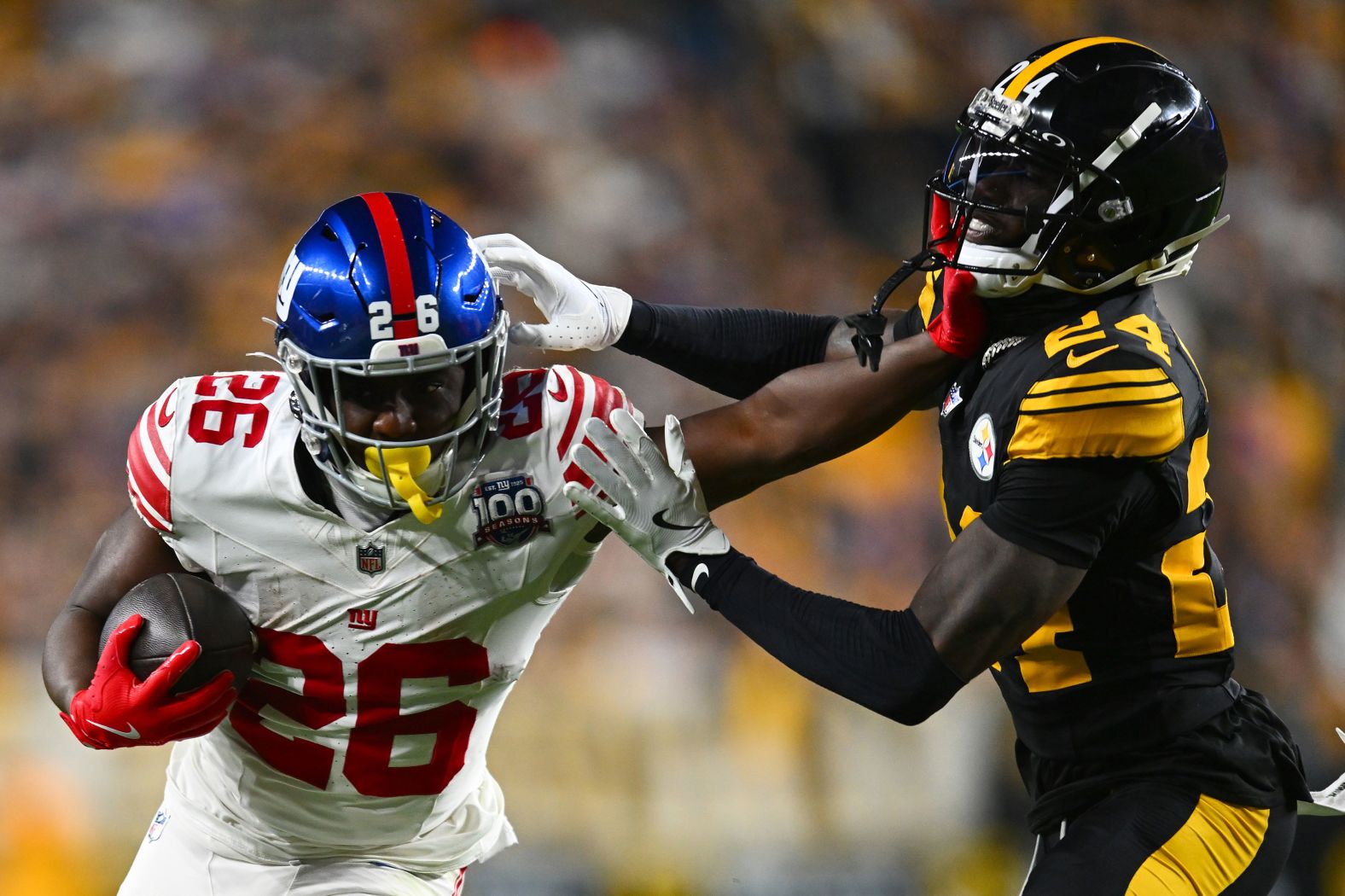 New York Giants running back Devin Singletary stiff arms Pittsburgh Steelers cornerback Joey Porter Jr. during the Steelers' 26-18 win in Pittsburgh on Monday, October 28.