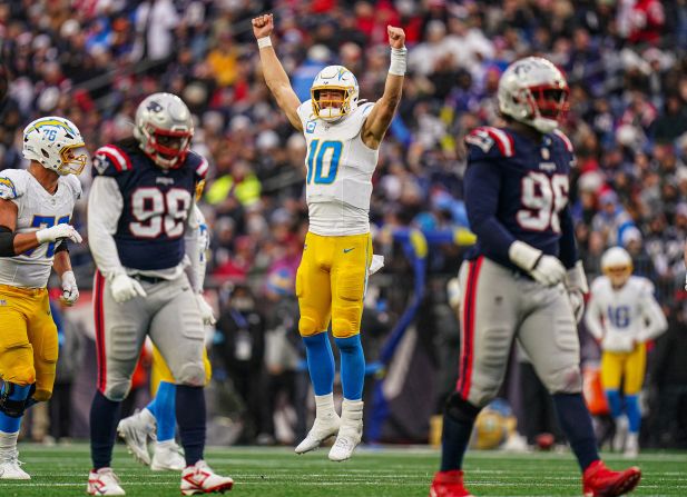 Los Angeles Chargers quarterback Justin Herbert celebrates after throwing a touchdown pass in Foxborough, Massachusetts, on Saturday, December 28. With his 281-yard outing, Herbert eclipsed Peyton Manning’s record for most passing yards in the first five years of a career. <a href="index.php?page=&url=https%3A%2F%2Fwww.cnn.com%2F2024%2F12%2F29%2Fsport%2Fnfl-week-17-saturday-wrap-spt-intl%2Findex.html">The Chargers beat the New England Patriots 40-7</a>.