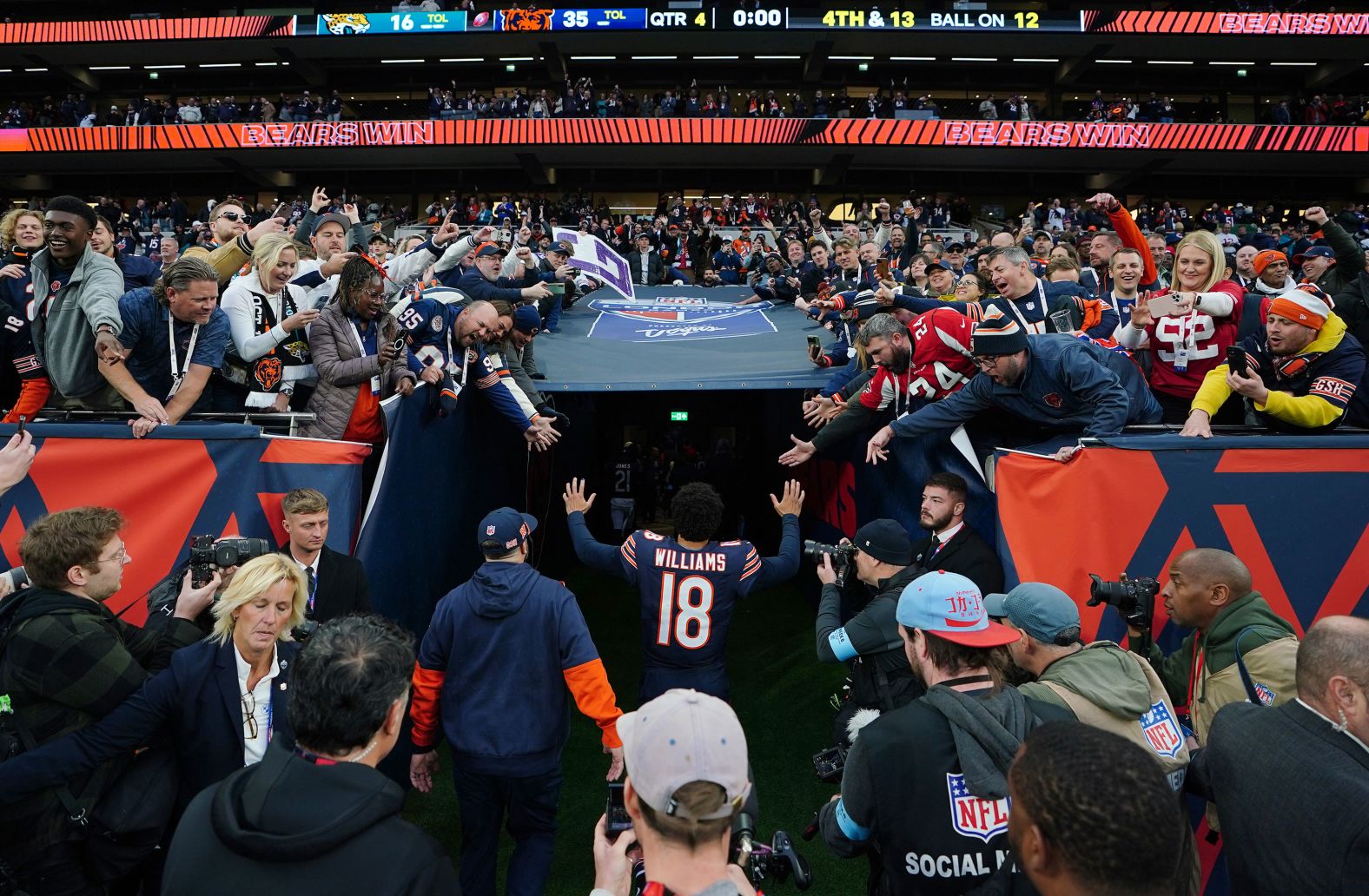 Chicago Bears quarterback Caleb Williams walks down the tunnel after his team <a href="index.php?page=&url=https%3A%2F%2Fwww.cnn.com%2F2024%2F10%2F13%2Fsport%2Fchicago-bears-jacksonville-jaguars-london-nfl-spt-intl%2Findex.html">beat the Jacksonville Jaguars 35-16</a> at the Tottenham Hotspur Stadium in London on October 13. Williams completed 23 of his 29 pass attempts and throwing for 226 yards and four touchdowns.