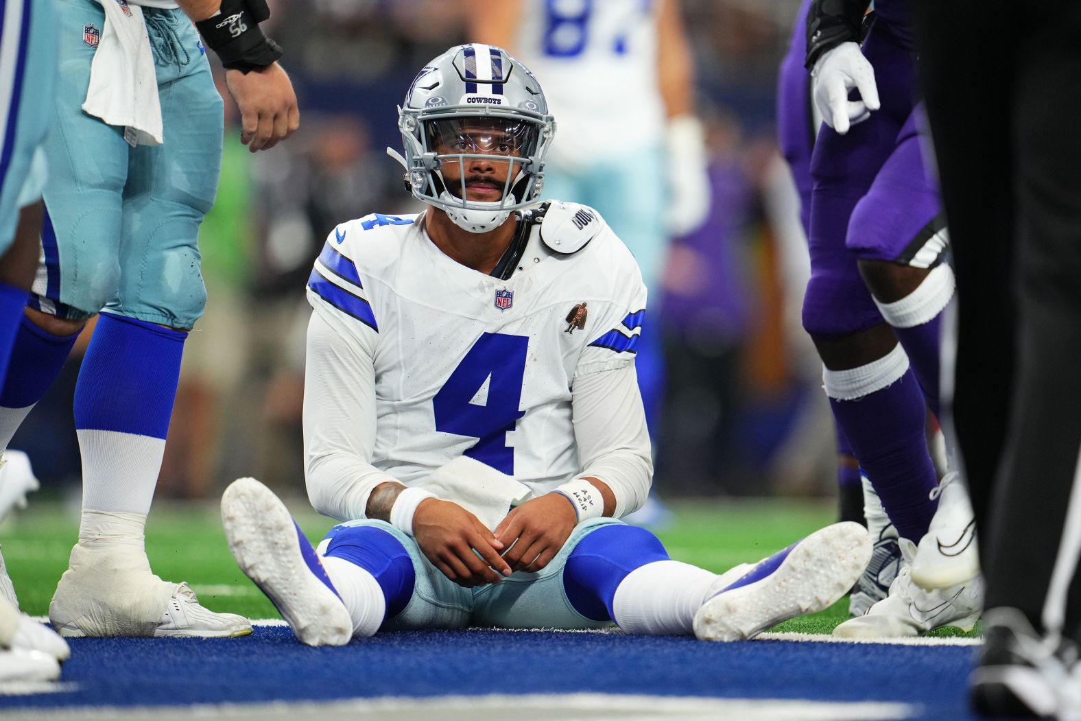 Dallas Cowboys quarterback Dak Prescott sits on the field after a play during the team's 28-25 loss to the Baltimore Ravens in Arlington, Texas, on September 22.