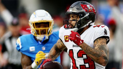 INGLEWOOD, CALIFORNIA - DECEMBER 15: Mike Evans #13 of the Tampa Bay Buccaneers carries the ball for a touchdown in the third quarter of the game against the Los Angeles Chargers at SoFi Stadium on December 15, 2024 in Inglewood, California. (Photo by Katelyn Mulcahy/Getty Images)