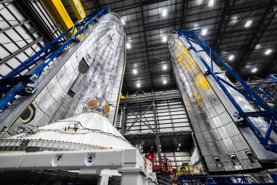 The Blue Ring Pathfinder demonstrator (left foreground), is seen with the two halves of the New Glenn rocket's payload fairing, or nose cone (background), on December 9, 2024. The demo will test technology that will be incoporated in Blue Origin's proposed spacecraft called Blue Ring.