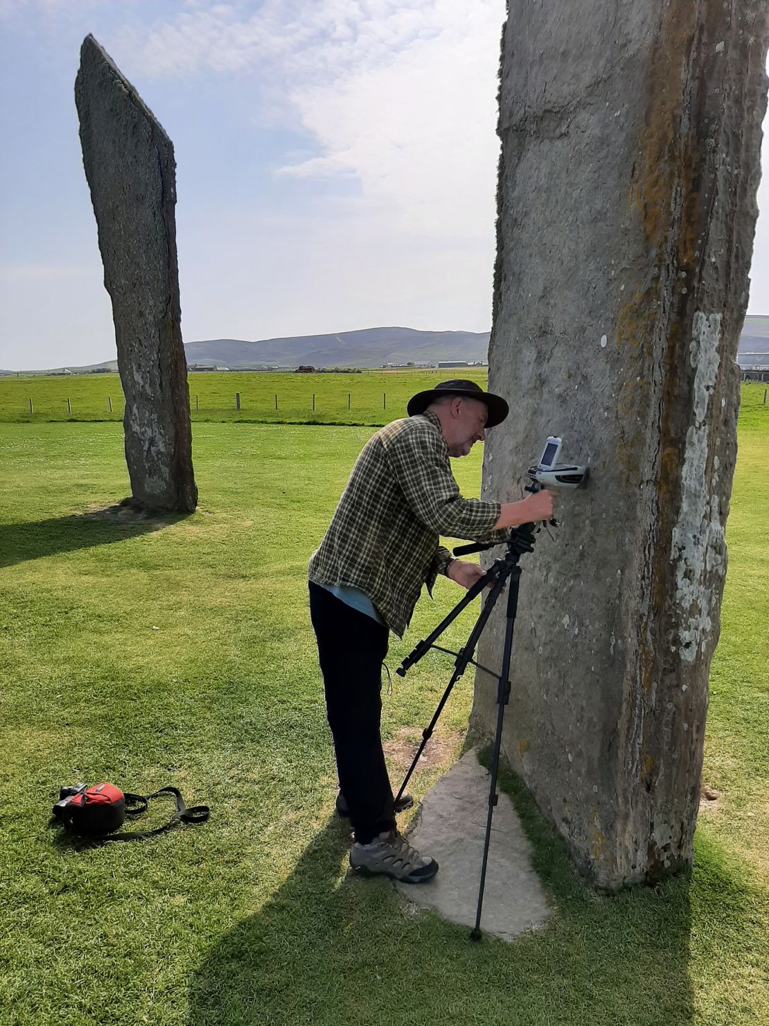 Study coauthor Nick Pearce, a professor of geography and Earth sciences at Aberystwyth University, analyzes Neolithic stones in Orkney, an archipelago off Scotland’s northeastern coast.