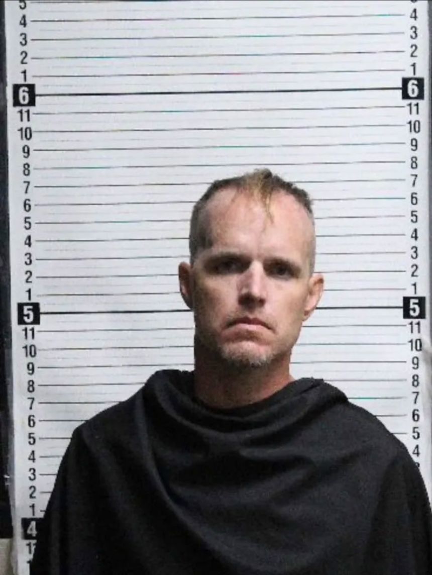 Nigel Edge, pictured in this mugshot, received several awards for his service in the Marines.