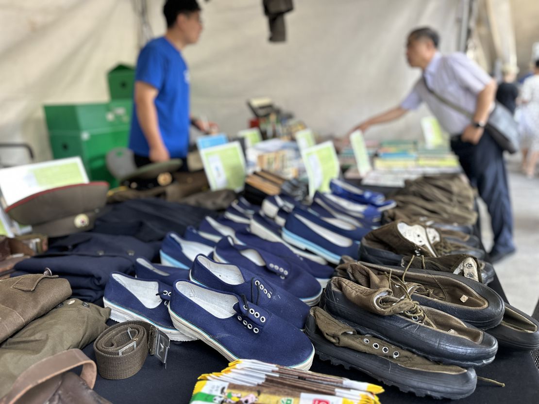 A non-profit organization runs a booth displaying daily life items used by North Koreans, including military boots, shoes and North Korean money, at the Defectors Day celebration in Seoul on July 14.