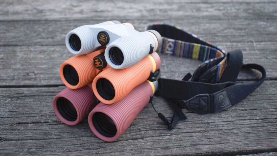 Three pairs of binoculars stacked on top of each other.