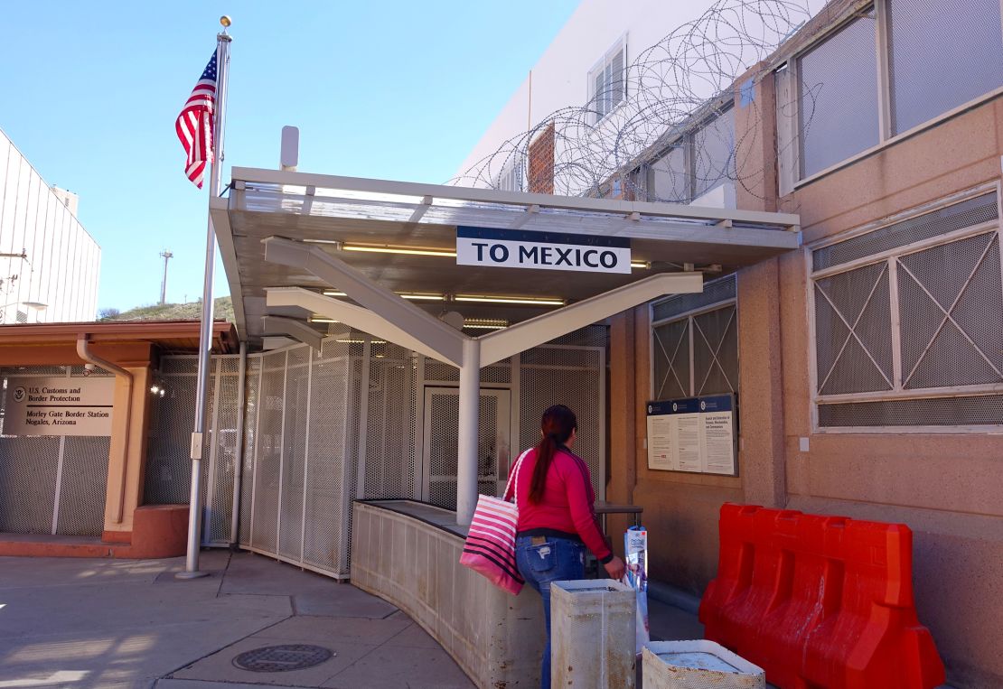 A person walks through the pedestrian crossing to Mexico at the Nogales-Morley Gate in Nogales, Arizona.