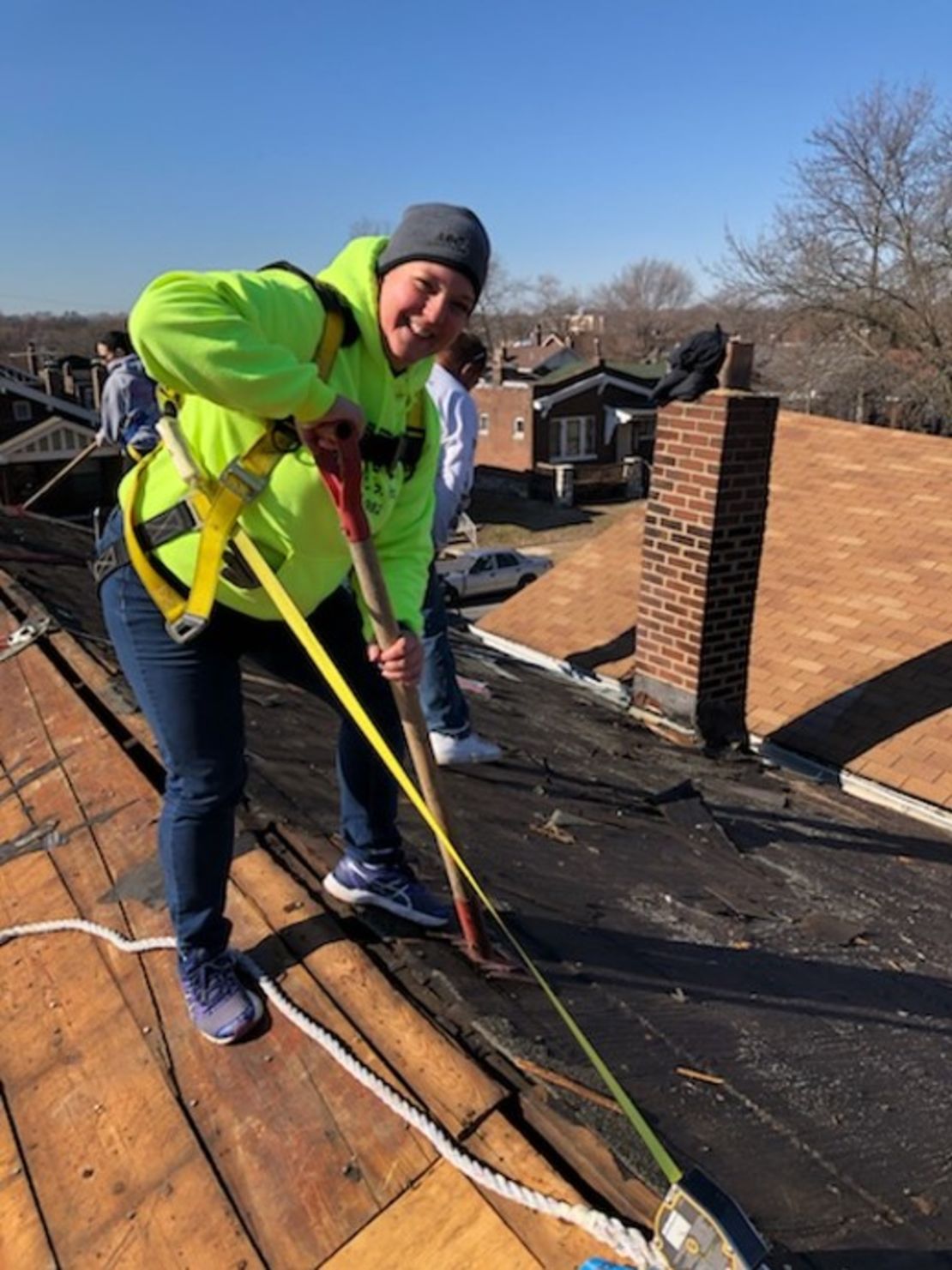 Bernadette Corbeil, founder of Artemis Construction Group, doing a roof tear off in February 2020.